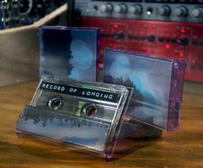 a third and final angle of three cassettes placed with care on a desk